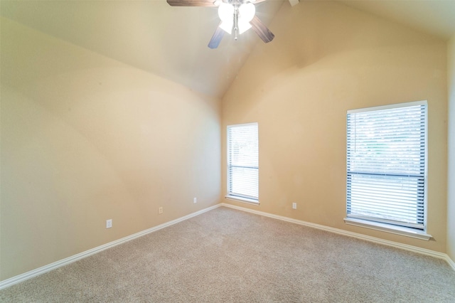unfurnished room featuring carpet flooring, a ceiling fan, baseboards, and high vaulted ceiling
