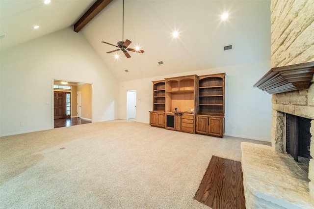 unfurnished living room featuring high vaulted ceiling, recessed lighting, a ceiling fan, beamed ceiling, and visible vents