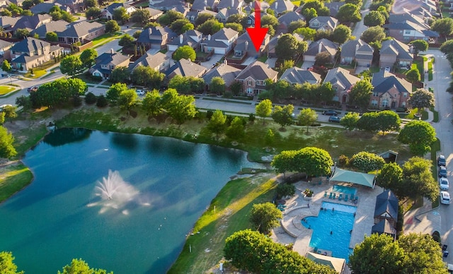 bird's eye view featuring a water view and a residential view