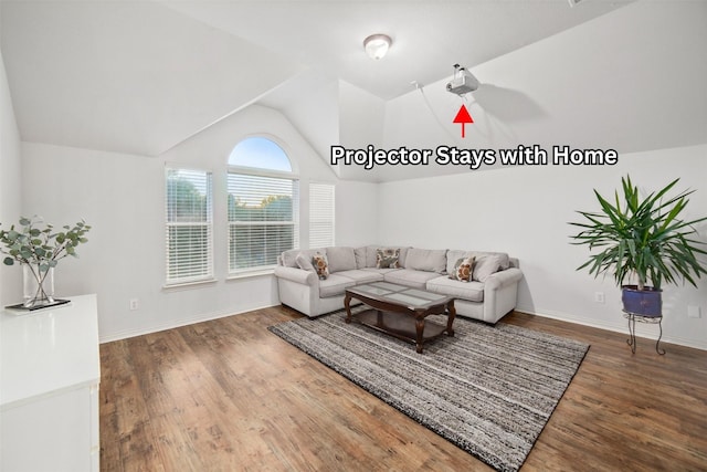 living room featuring baseboards, vaulted ceiling, and wood finished floors