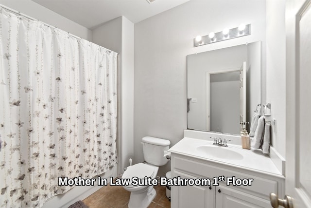 full bathroom with toilet, tile patterned floors, a shower with curtain, and vanity