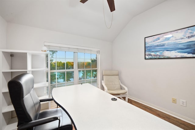 home office featuring baseboards, ceiling fan, wood finished floors, and lofted ceiling