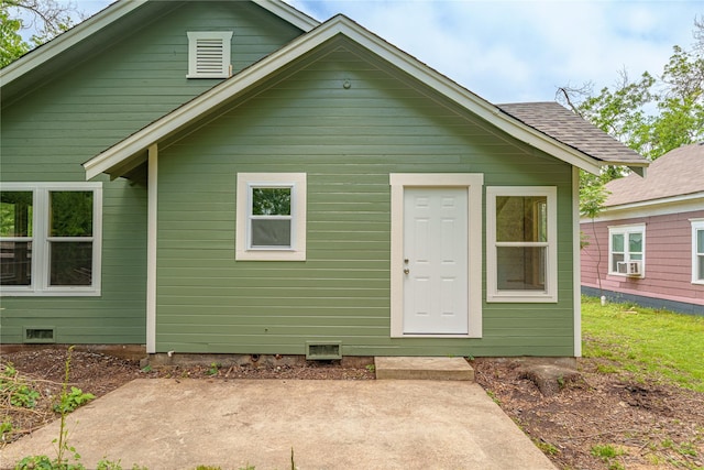 back of house with a patio and crawl space