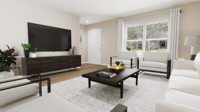 living area with baseboards, recessed lighting, and wood finished floors