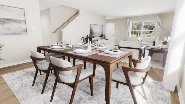 dining space with light wood-style floors, baseboards, and recessed lighting