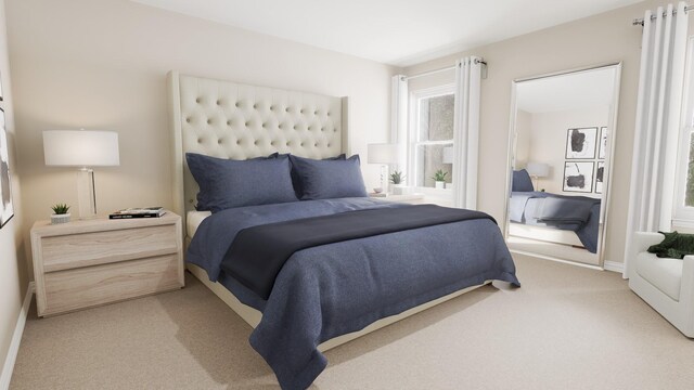 bedroom with light colored carpet and baseboards