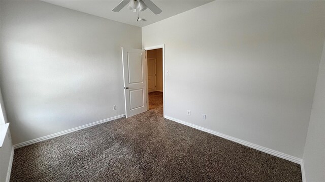 spare room featuring carpet floors, baseboards, and a ceiling fan