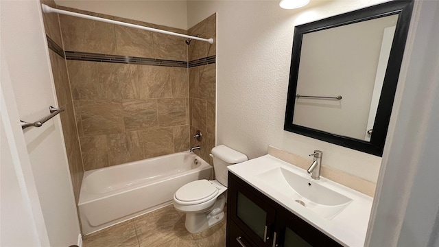 full bath with vanity, a textured wall, shower / bathtub combination, and toilet