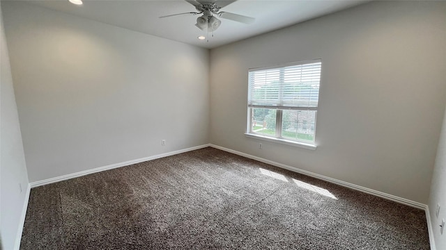 spare room with dark carpet, a ceiling fan, baseboards, and recessed lighting