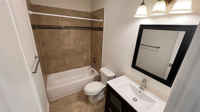 bathroom with toilet, bathing tub / shower combination, and vanity