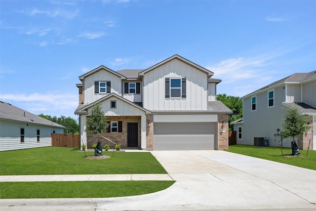 1605 Annabelle St, Cleburne, TX 76031 - view of front facade featuring brick siding, board and batten siding, an attached garage, and driveway