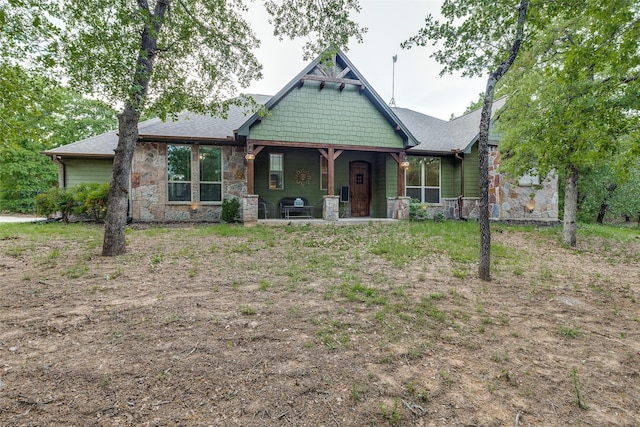 580 Leatherwood Ln, Poolville, TX 76487 - view of front of property with a shingled roof and stone siding