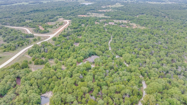 580 Leatherwood Ln, Poolville, TX 76487 - birds eye view of property featuring a wooded view