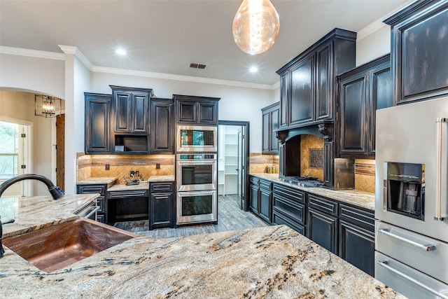 580 Leatherwood Ln, Poolville, TX 76487 - kitchen with visible vents, light wood-type flooring, light stone counters, a sink, and stainless steel appliances