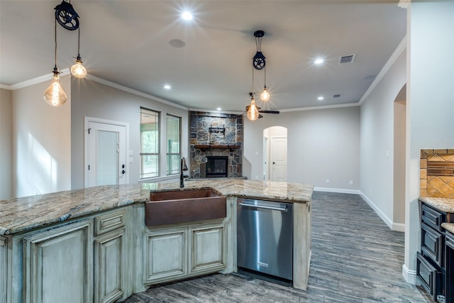 580 Leatherwood Ln, Poolville, TX 76487 - kitchen featuring arched walkways, dishwasher, a sink, open floor plan, and ornamental molding