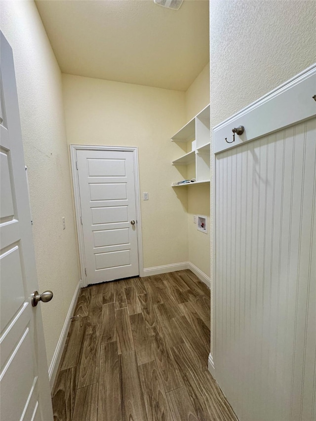 washroom featuring washer hookup, laundry area, baseboards, dark wood-type flooring, and visible vents