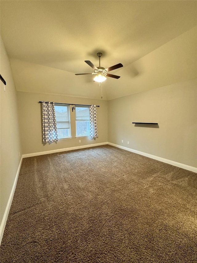 carpeted spare room with baseboards, ceiling fan, and lofted ceiling