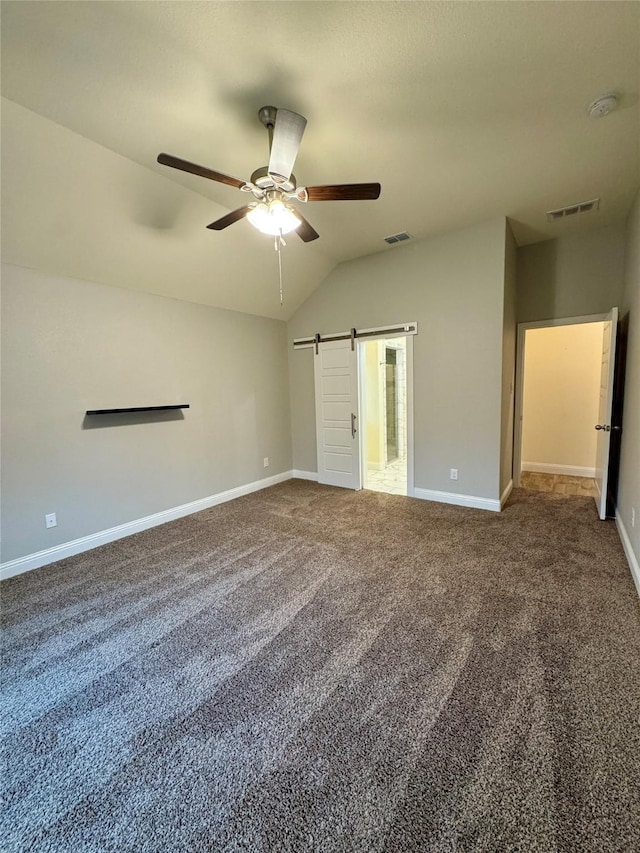 interior space with a ceiling fan, baseboards, visible vents, and lofted ceiling