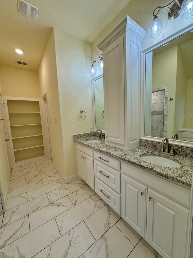 full bathroom with visible vents, a sink, and marble finish floor