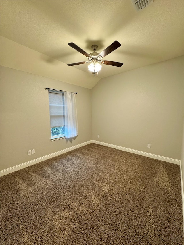 unfurnished room featuring a ceiling fan, baseboards, visible vents, and dark carpet