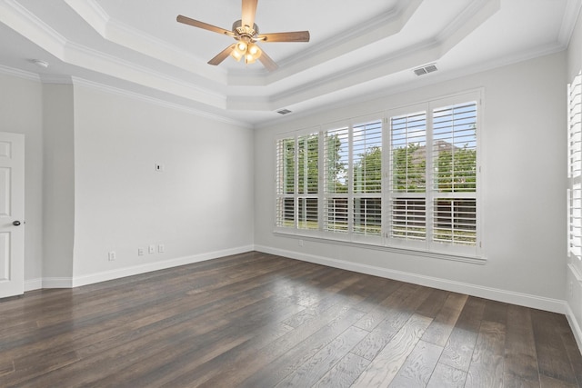 821 High Willow Dr, Prosper, TX 75078 - spare room featuring crown molding, a tray ceiling, dark wood-type flooring, and visible vents