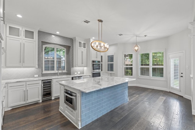 821 High Willow Dr, Prosper, TX 75078 - kitchen featuring beverage cooler, white cabinetry, visible vents, and a wealth of natural light