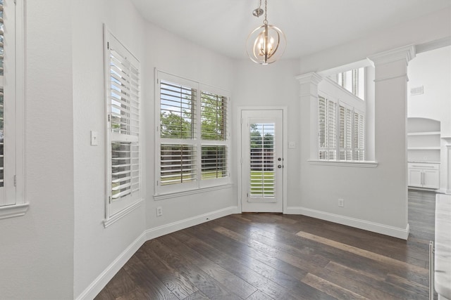 821 High Willow Dr, Prosper, TX 75078 - unfurnished dining area with baseboards, a notable chandelier, dark wood-style floors, and a wealth of natural light