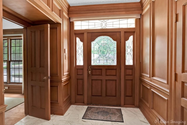 foyer entrance featuring marble finish floor