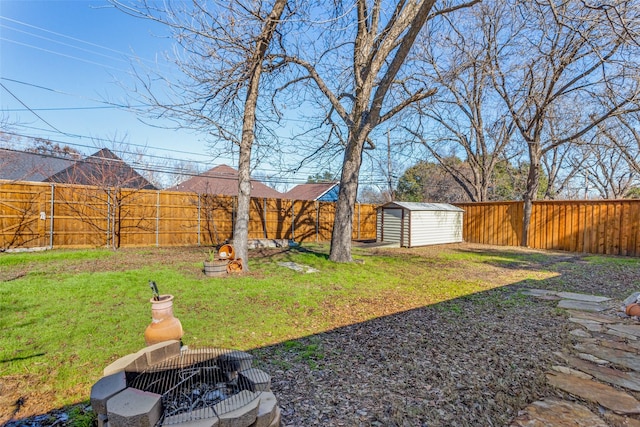 view of yard with a fenced backyard, an outdoor structure, and a shed