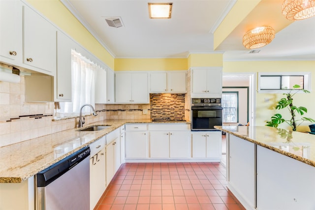 kitchen featuring stovetop, tasteful backsplash, stainless steel dishwasher, a sink, and oven