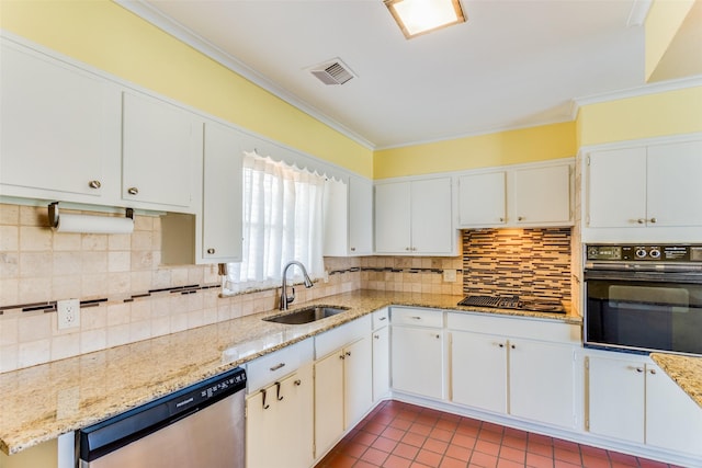 kitchen with visible vents, crown molding, appliances with stainless steel finishes, tasteful backsplash, and a sink