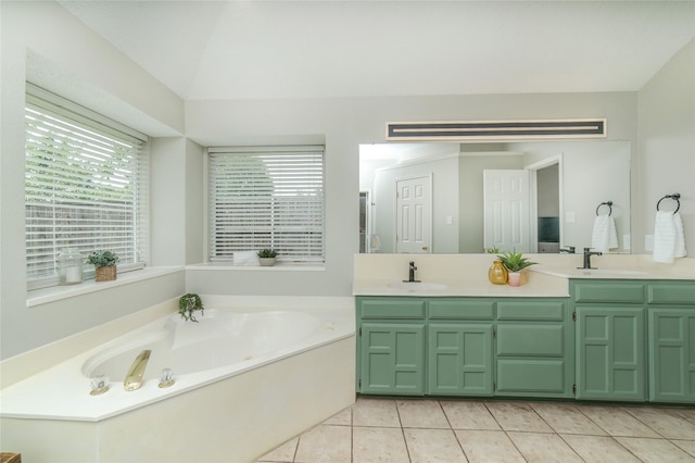 bathroom with a garden tub, a sink, tile patterned flooring, and double vanity