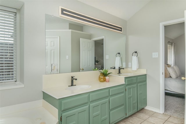 bathroom featuring a sink, tile patterned flooring, double vanity, and connected bathroom