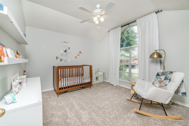 bedroom with baseboards, carpet, and lofted ceiling