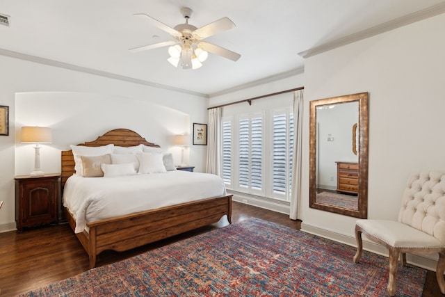 bedroom with ornamental molding, a ceiling fan, wood finished floors, and visible vents