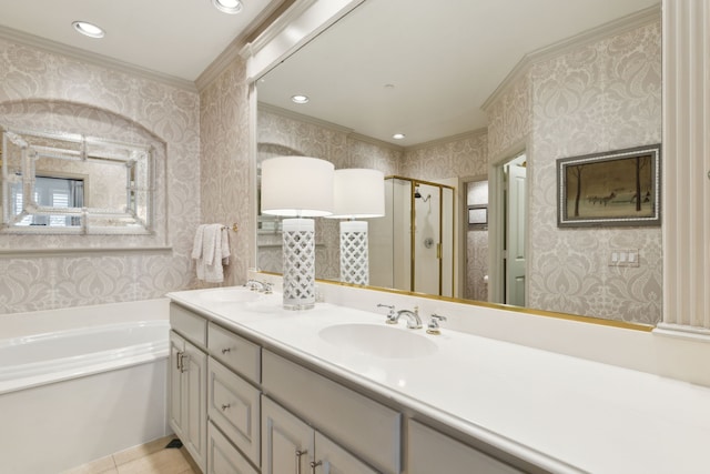 bathroom featuring ornamental molding, a sink, and a stall shower
