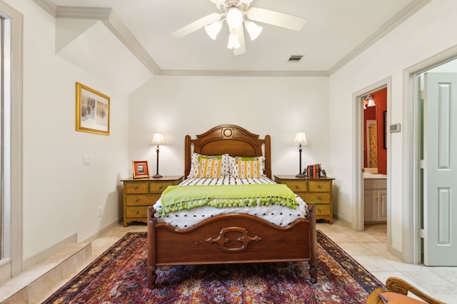 bedroom featuring crown molding, connected bathroom, light tile patterned flooring, and visible vents