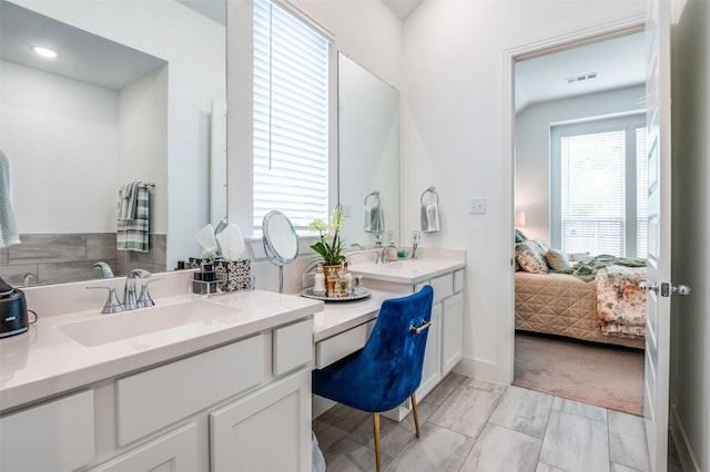 1130 Holcombe Dr, Anna, TX 75409 - bathroom featuring vanity, baseboards, visible vents, and ensuite bath