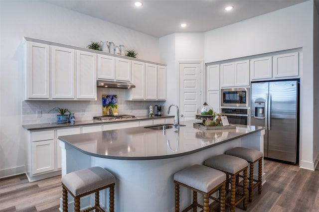1130 Holcombe Dr, Anna, TX 75409 - kitchen featuring a sink, tasteful backsplash, a breakfast bar, and stainless steel appliances