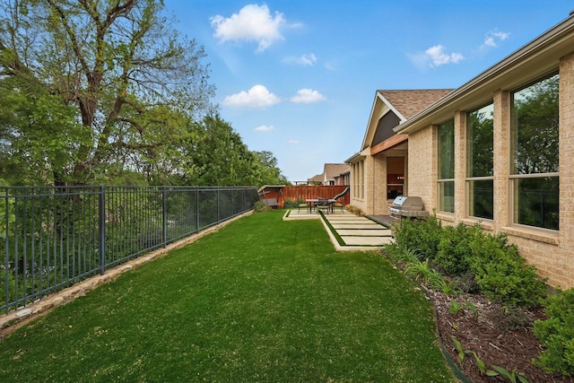 view of yard featuring a fenced backyard
