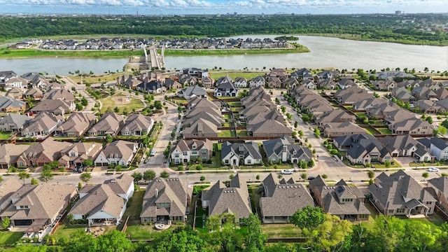 birds eye view of property featuring a water view and a residential view