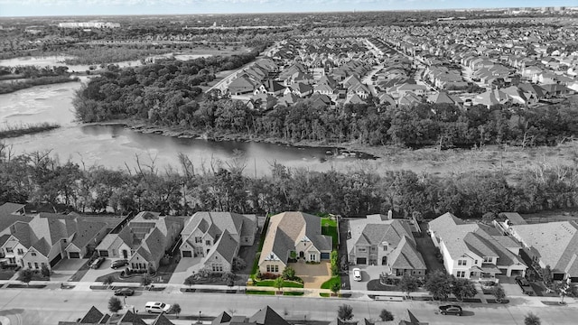 birds eye view of property with a water view and a residential view