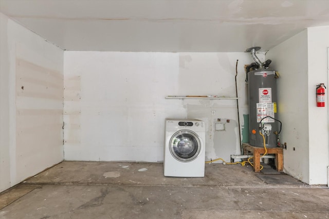 clothes washing area with laundry area, washer / dryer, and gas water heater