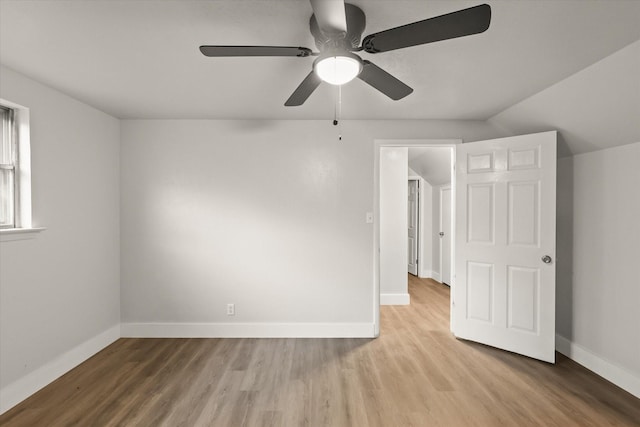 unfurnished bedroom featuring a ceiling fan, baseboards, and wood finished floors