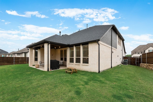 1719 Godello Dr, Mclendon Chisholm, TX 75032 - rear view of house featuring a fenced backyard, a yard, a patio area, and brick siding