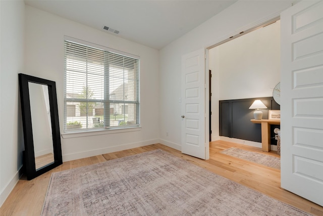 1719 Godello Dr, Mclendon Chisholm, TX 75032 - spare room featuring baseboards, wood finished floors, and visible vents