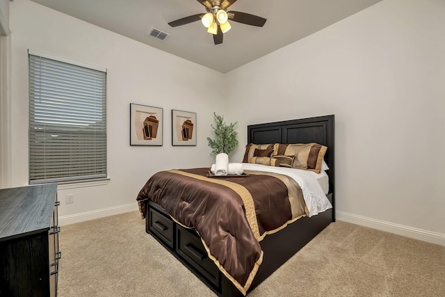 bedroom with visible vents, carpet, ceiling fan, and baseboards