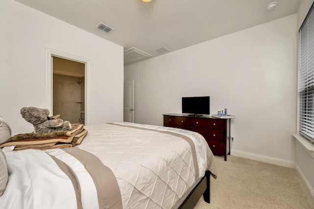 bedroom featuring light colored carpet, baseboards, visible vents, and attic access