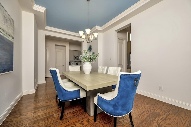 dining area featuring baseboards, an inviting chandelier, ornamental molding, and dark wood-type flooring