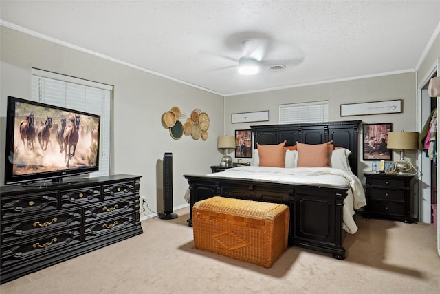 bedroom with light colored carpet, ornamental molding, a textured ceiling, and ceiling fan